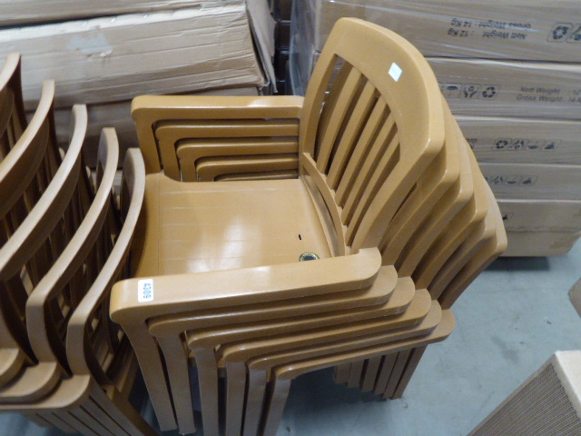 6 brown plastic stacking chairs