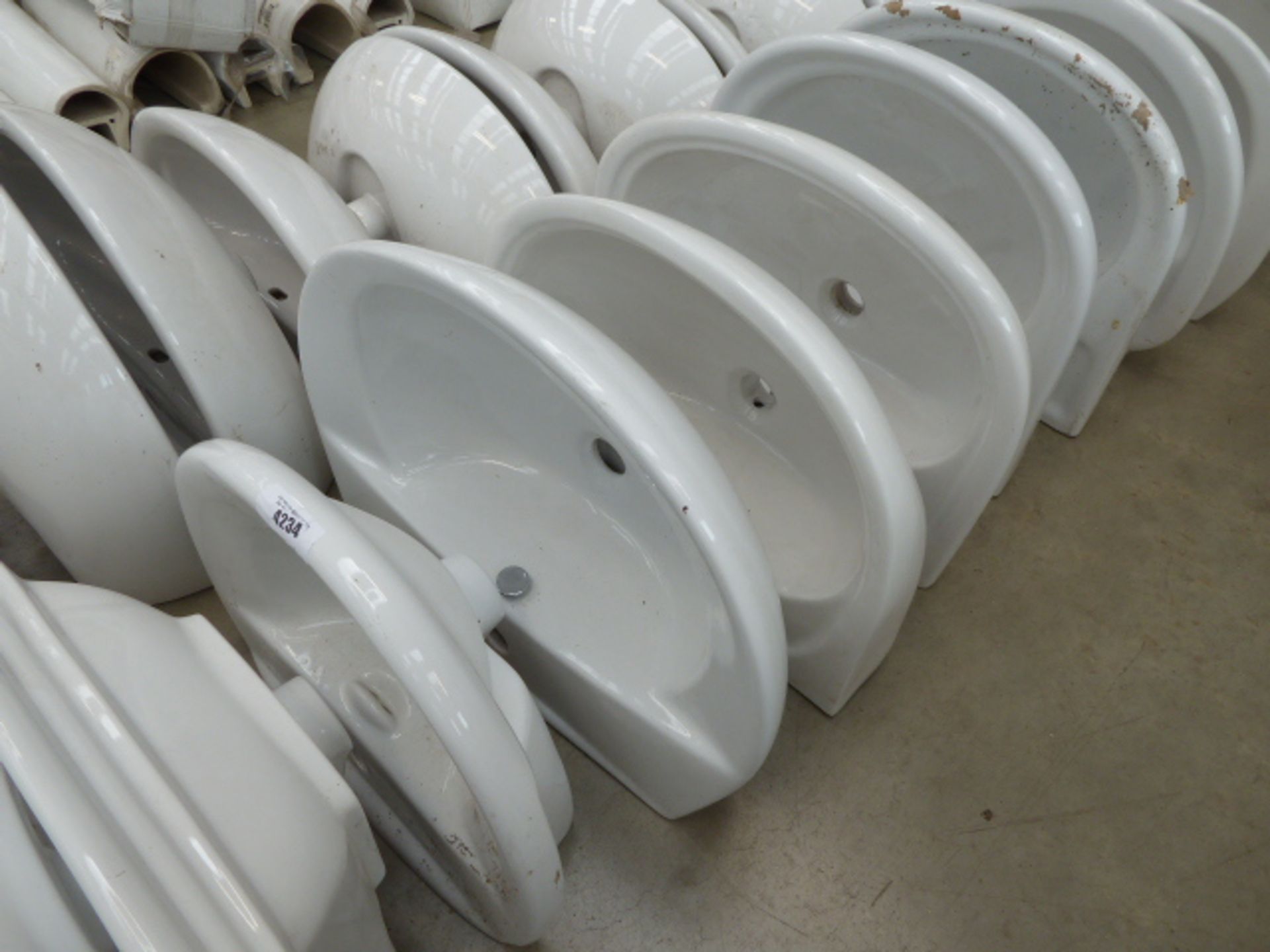 1 small and 7 large curved fronted sinks