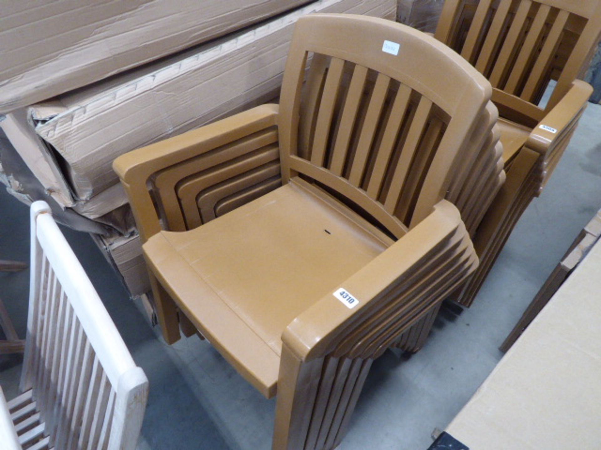 6 brown plastic stacking chairs