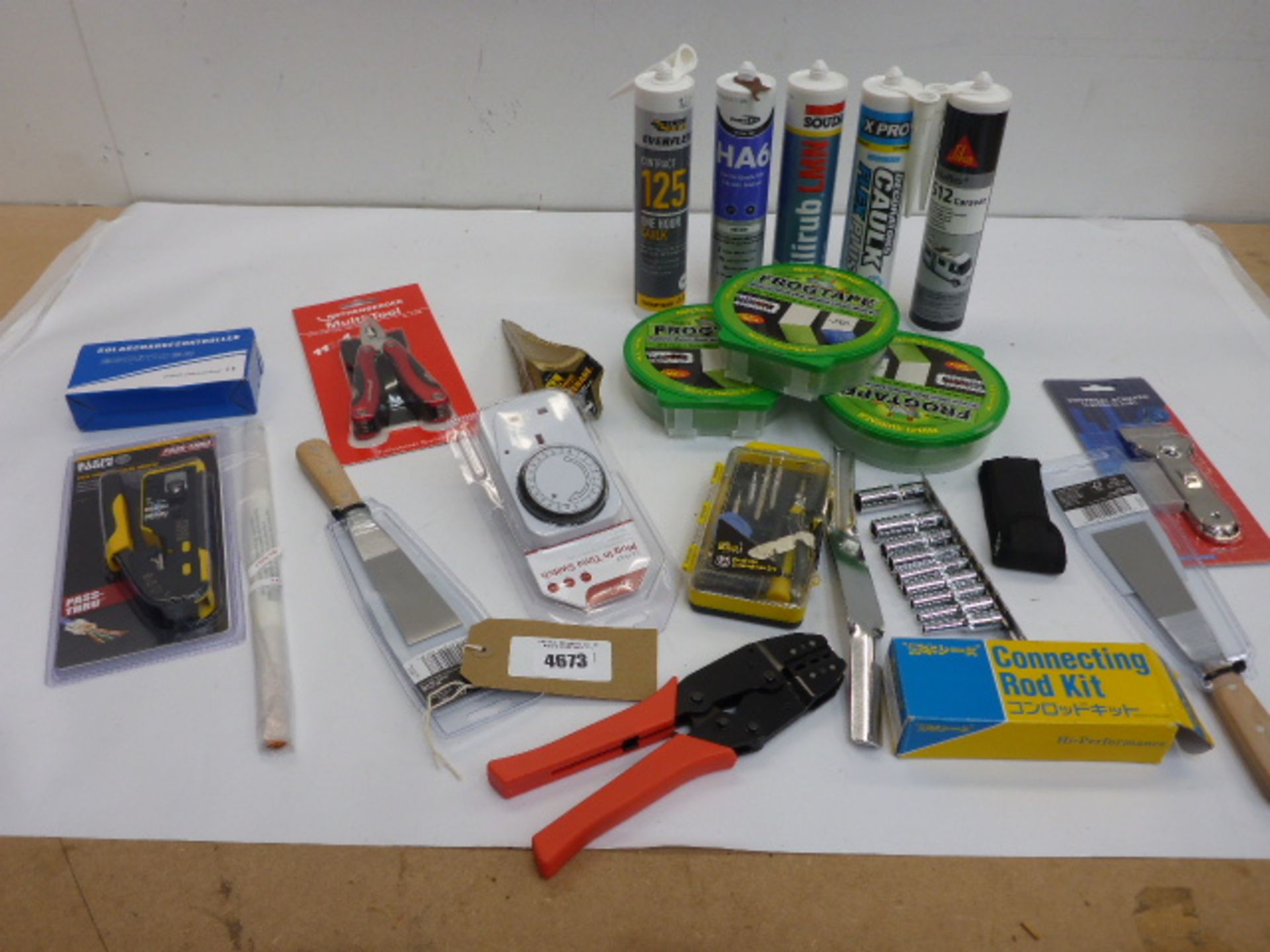 Decorators Caulk, sealant, Frog tape, multi tool, modular crimper, wire strippers, sockets,