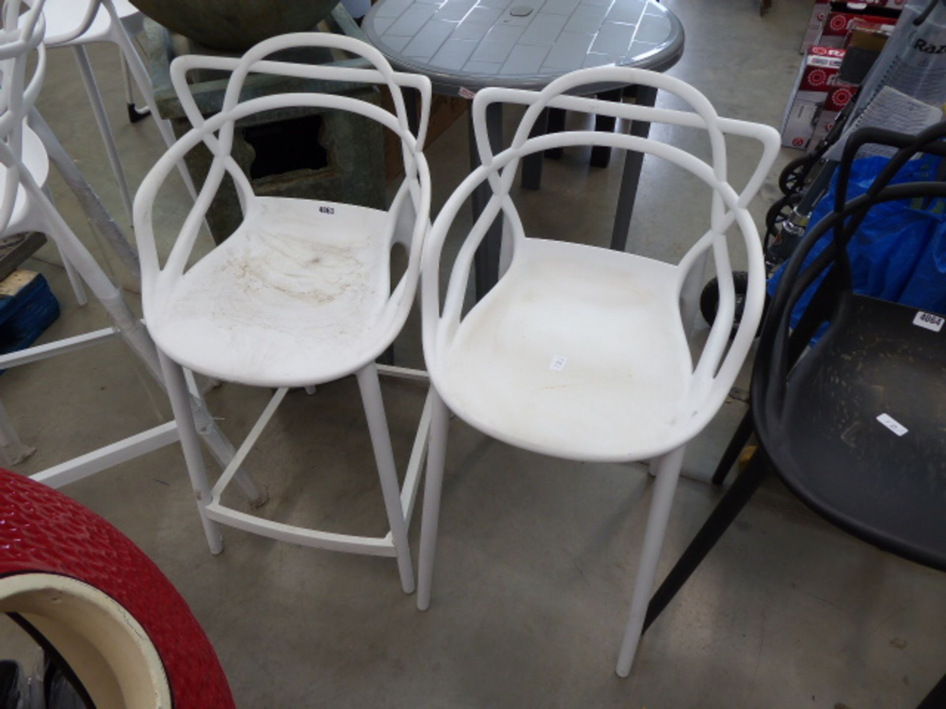 2 low white bar stools