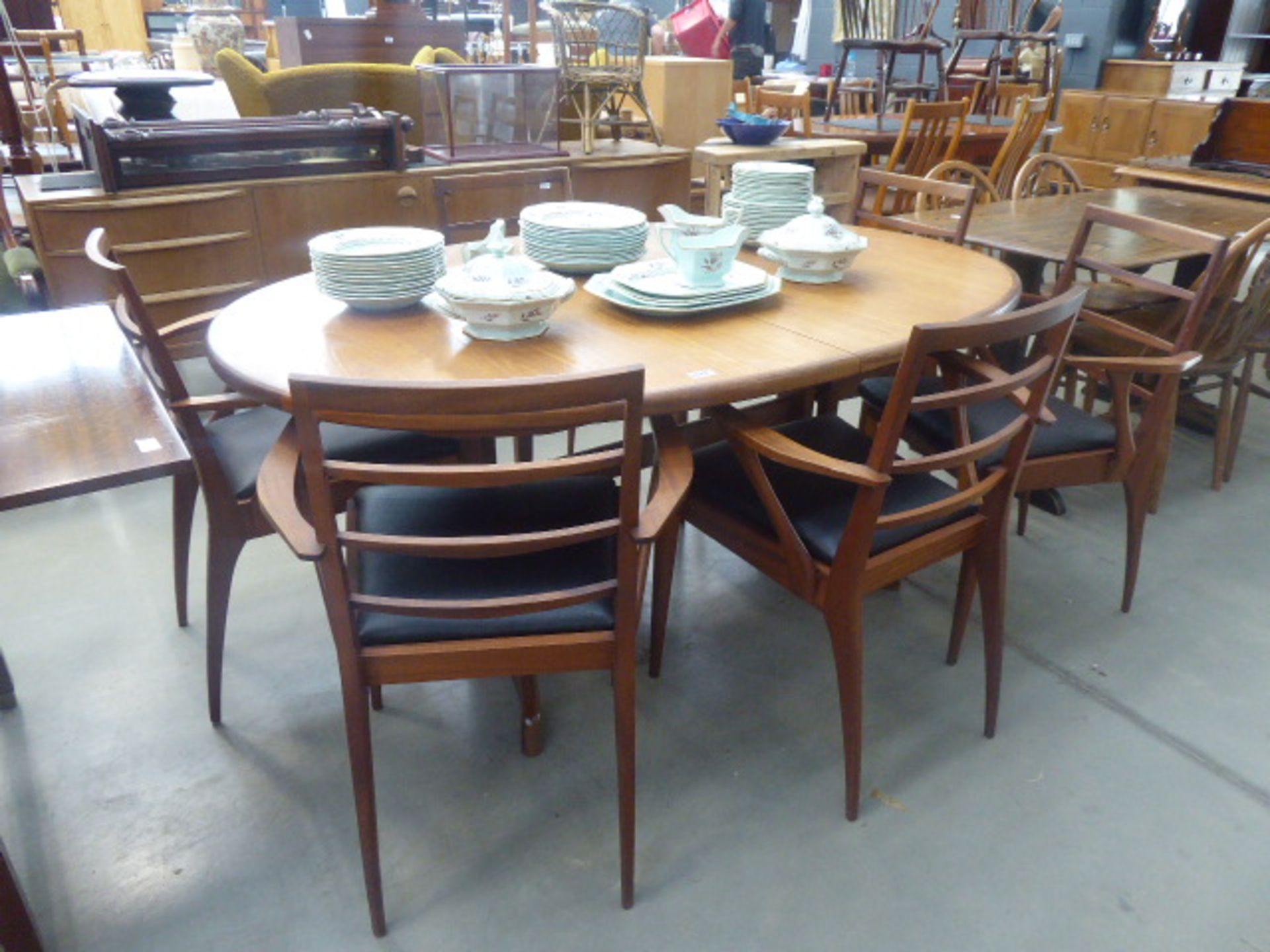 Oval teak G Plan extending dining table plus six Danish teak chairs. Collectors item see soft