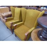 A pair of mustard wingback armchairs. Collectors item see soft furnishings policy