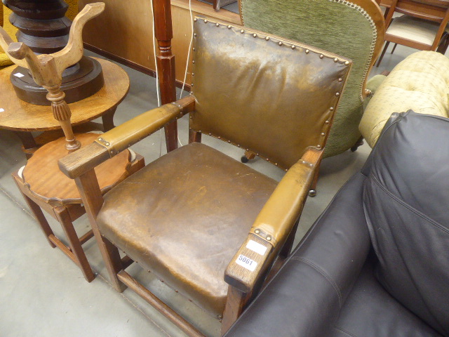Oak brown leather armchair with exposed frame