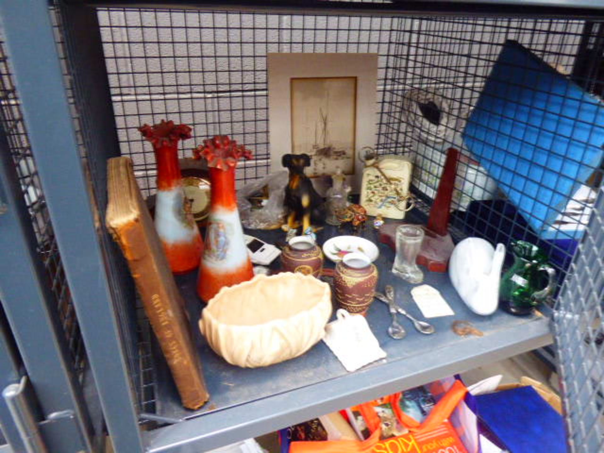 Cage containing ornamental figures, Japanese vases, glassware, crested ware, and a mantel clock