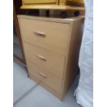 Oak finished three drawer bedside cabinet