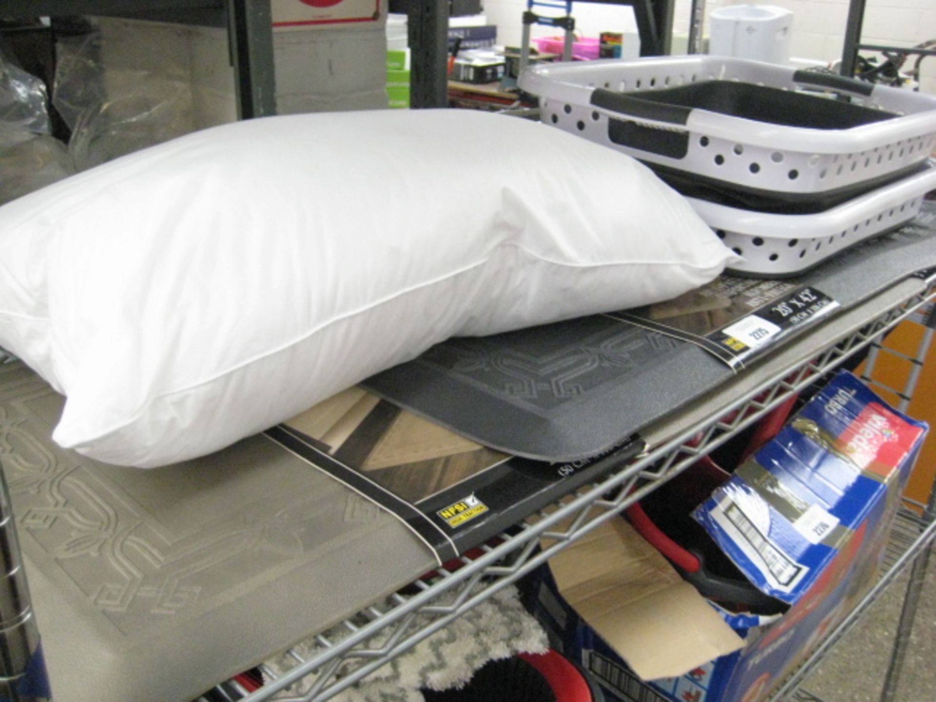 Shelf of housewares incl. anti slip mats, space saving laundry baskets and pillow