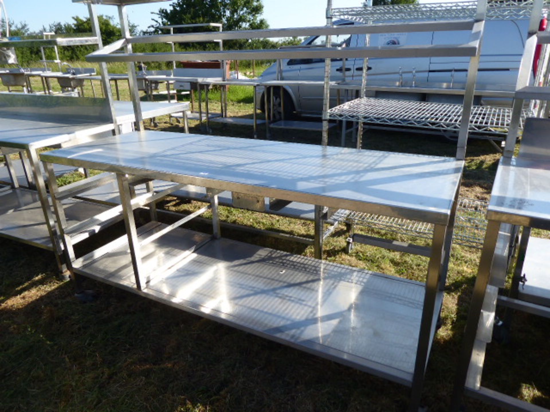 Stainless steel mobile food preparation station with 1 shelf over, shelf under space for trays and a - Image 2 of 2