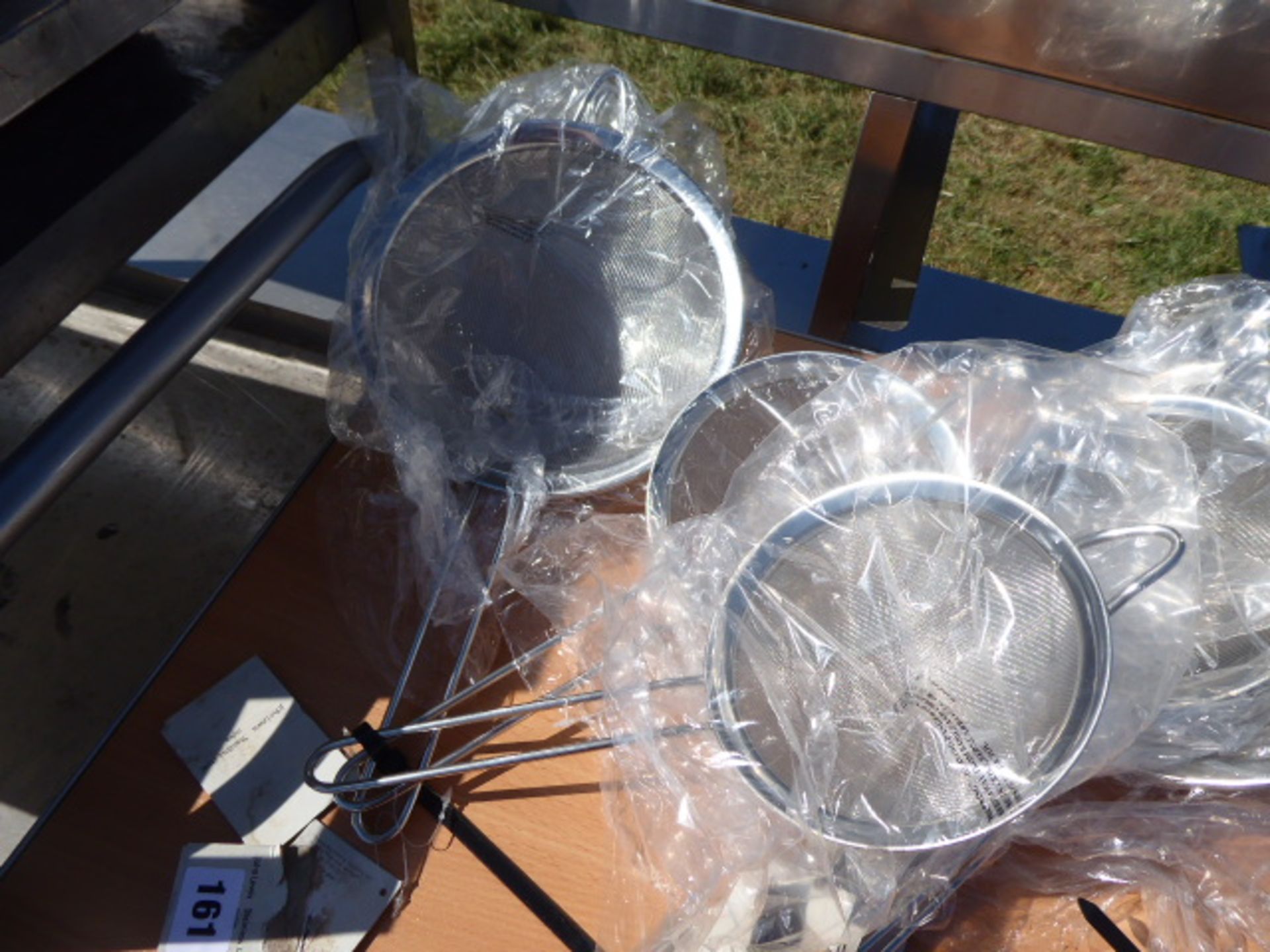 4 graduated sized John Lewis stainless steel sieves