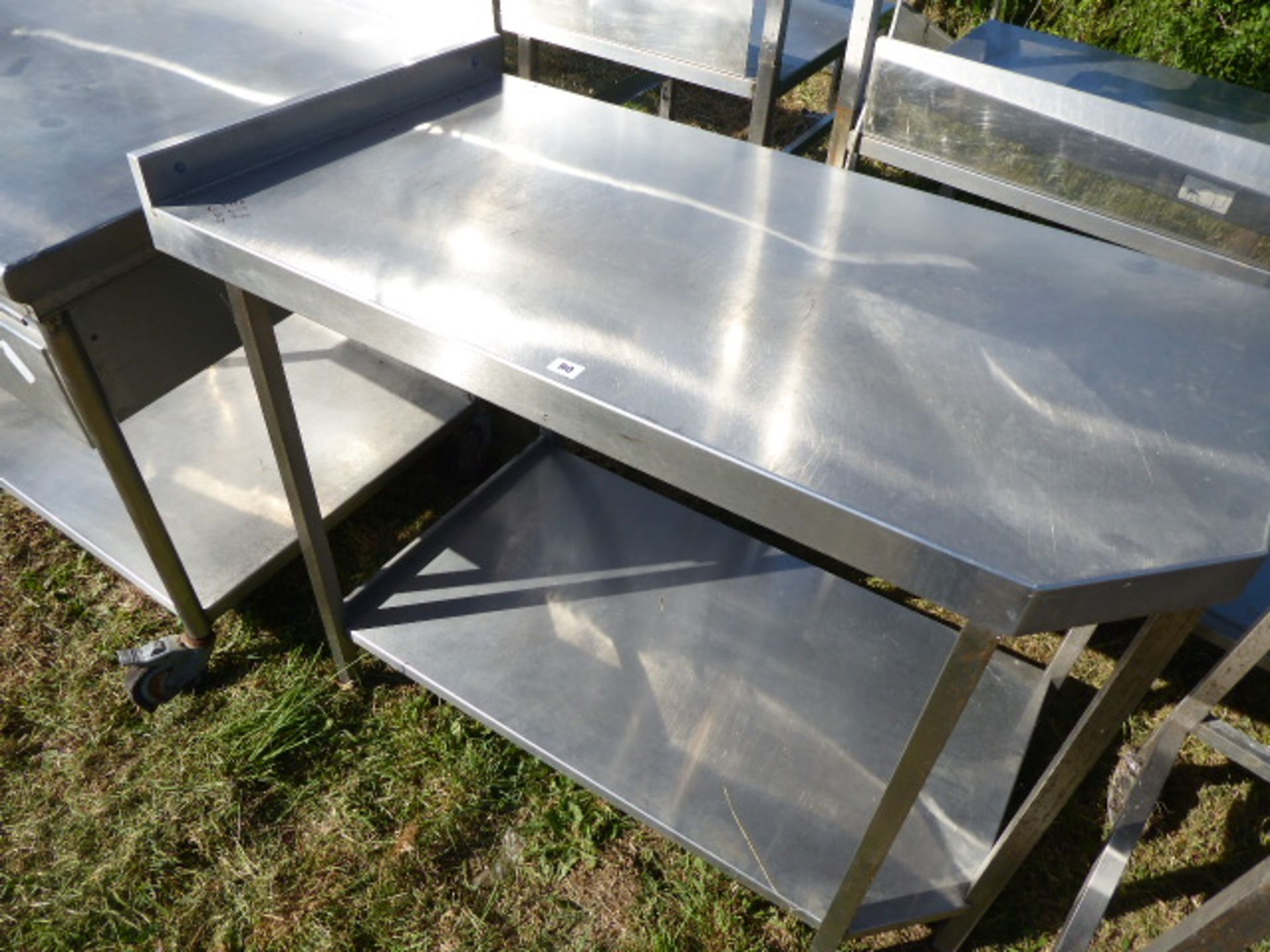 Stainless steel table with shelf under, with a small cut out corner,1880mm wide, 650mm deep and - Image 2 of 2