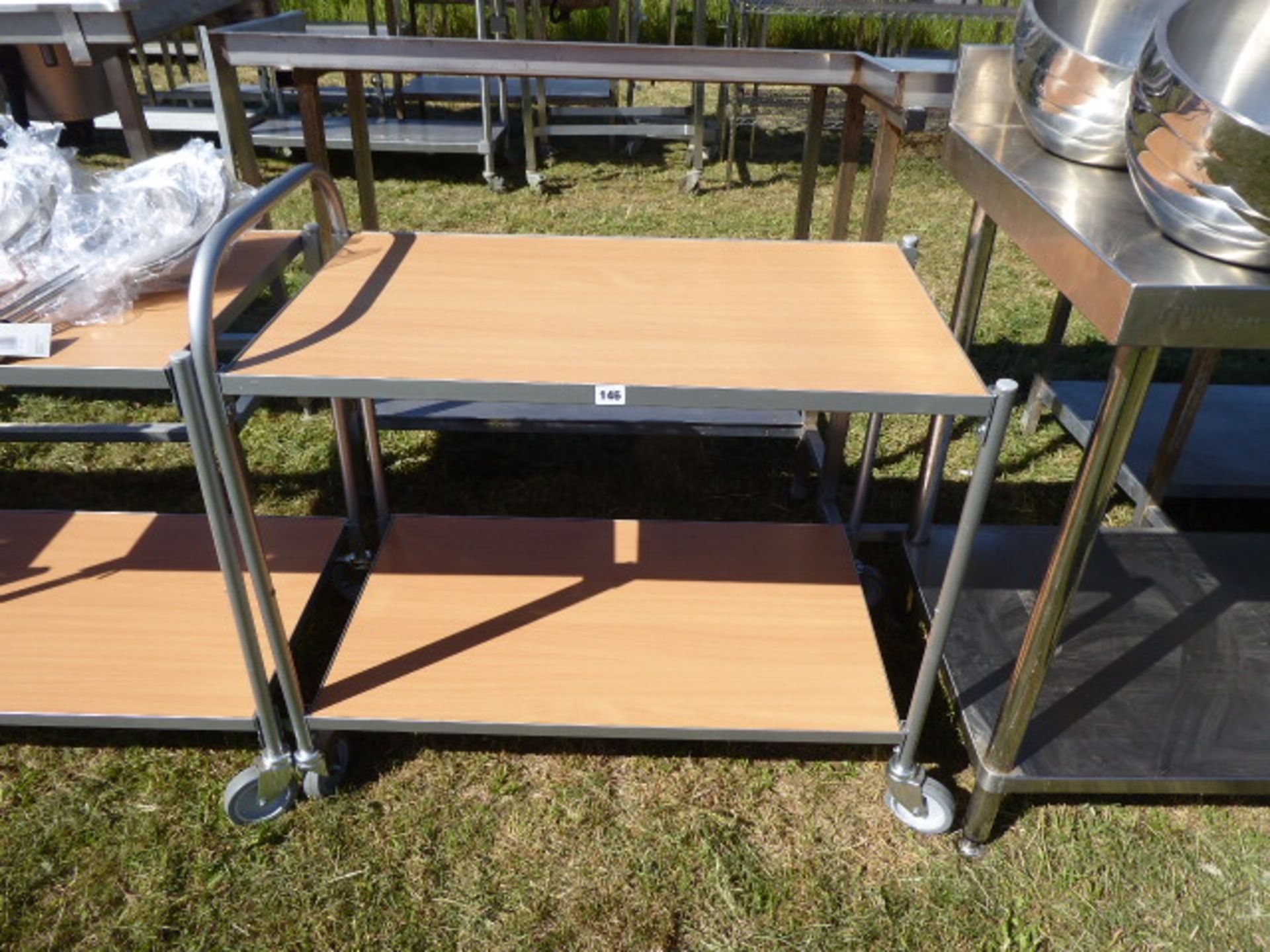 2 tier mobile catering trolly with metal tubular frame and wooden shelves, 850mm wide