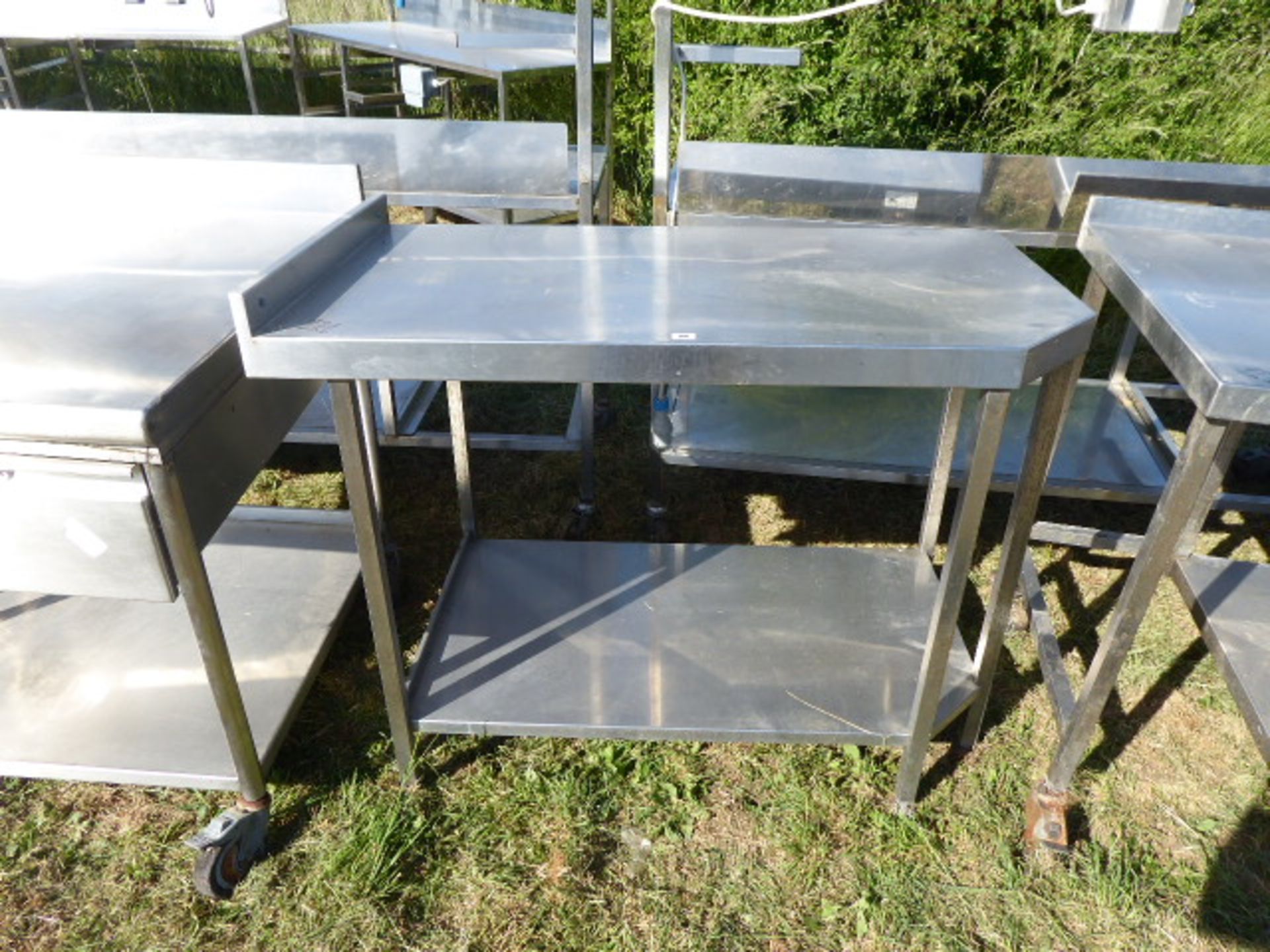 Stainless steel table with shelf under, with a small cut out corner,1880mm wide, 650mm deep and