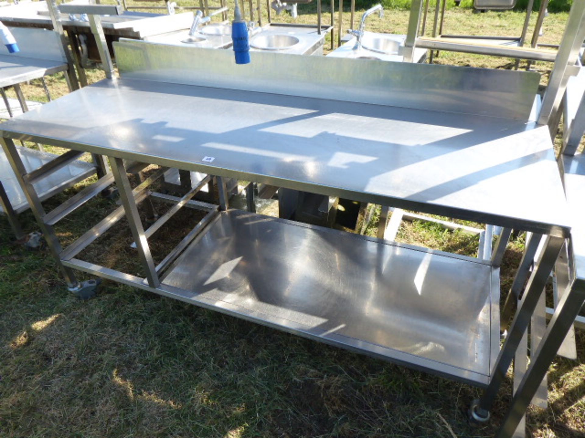 Stainless steel mobile food preparation station with 2 shelves over, shelf under space for trays, - Image 2 of 3