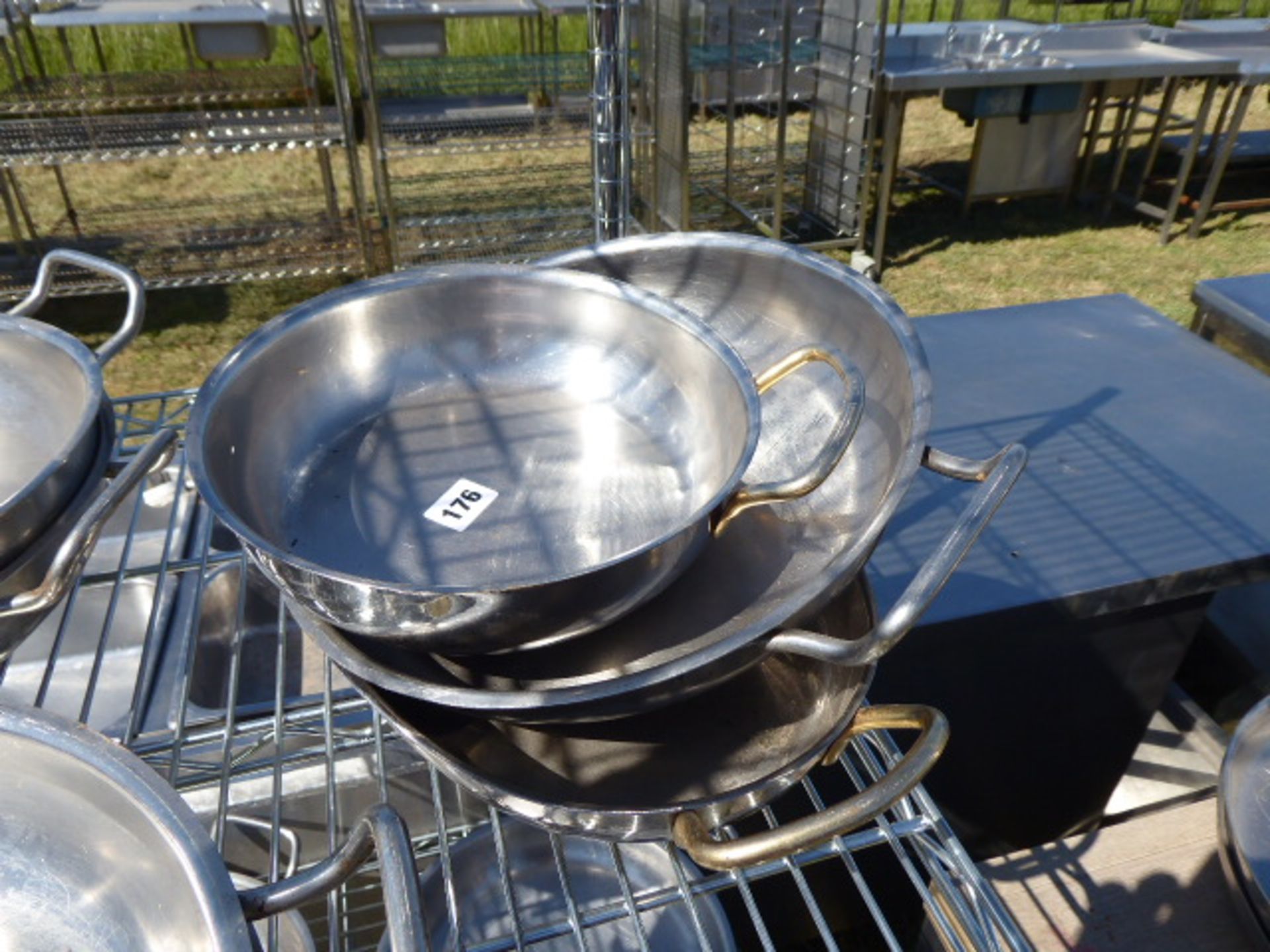 3 assorted sized twin handled stainless dishes