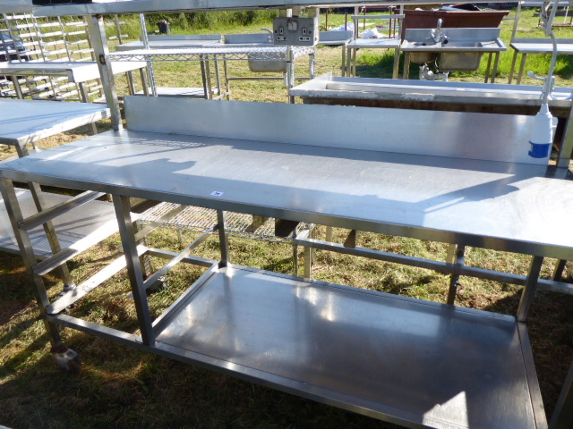 Stainless steel mobile food preparation station with 2 shelves over, shelf under space for trays, - Image 2 of 3