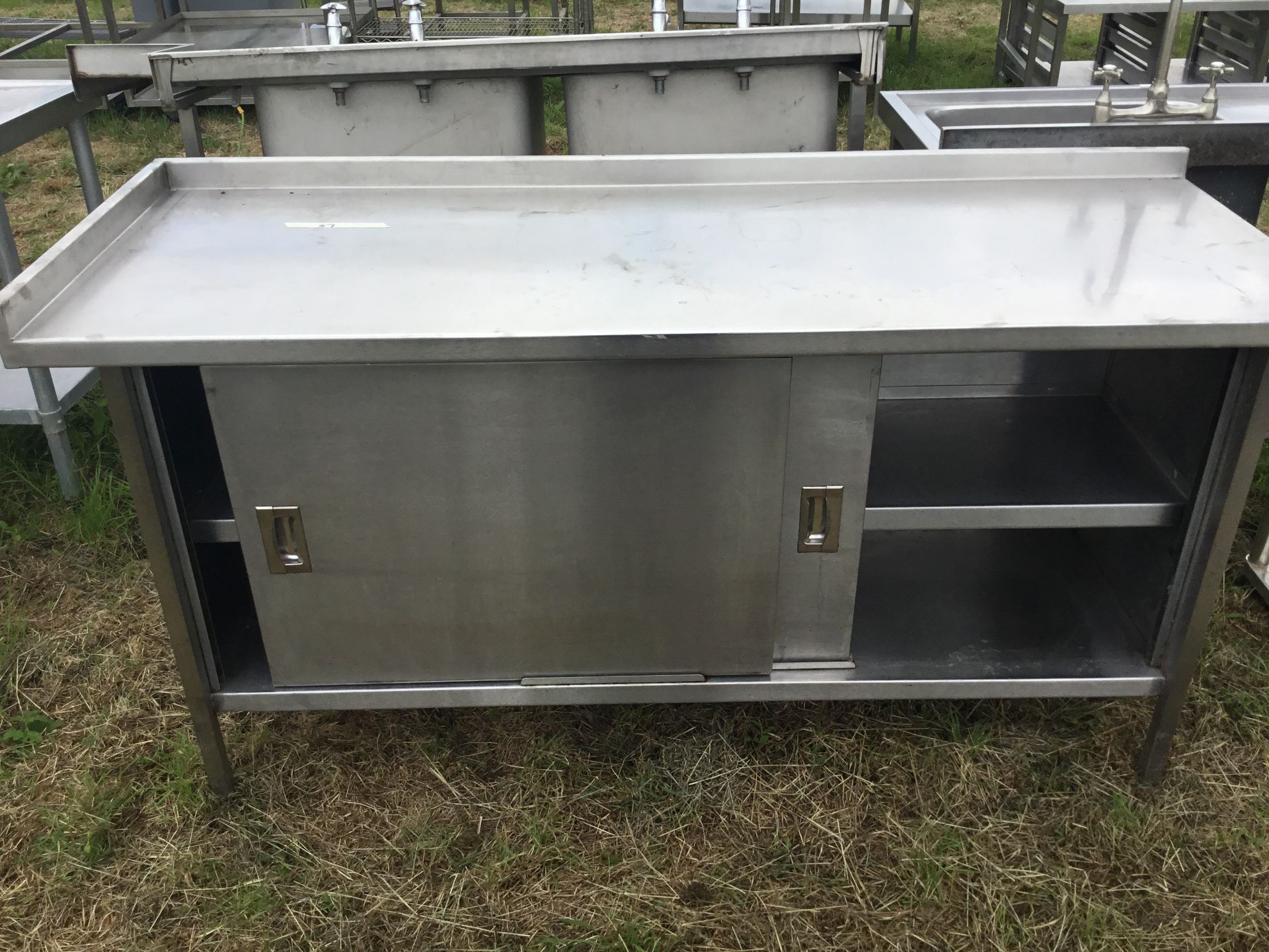 Stainless steel table with 2 door cupboard, 1800mm x 650mm x 900mm