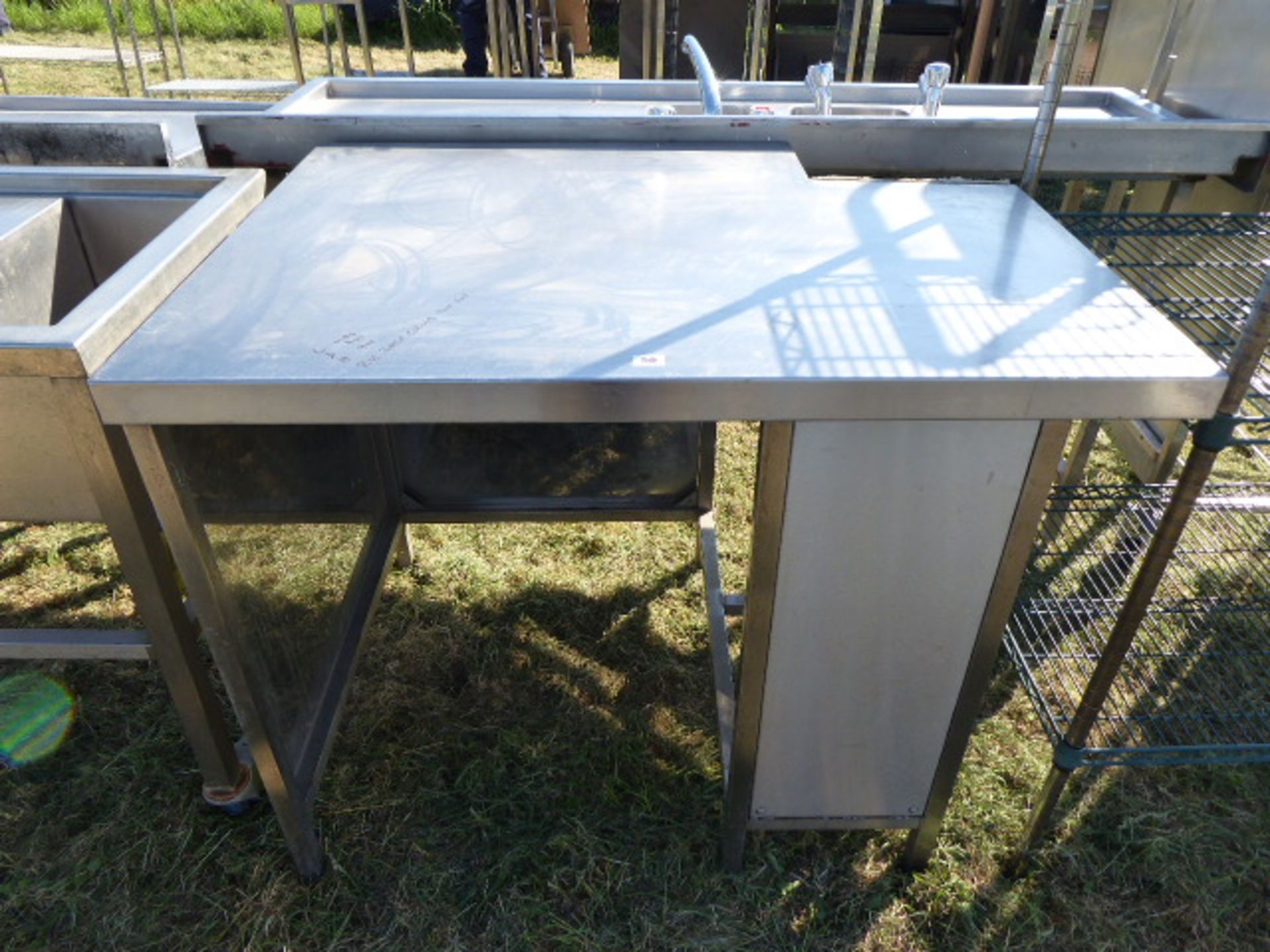 Stainless steel preparation table with a rear corner cut out, 1100mm wide, 800mm deep and 910mm high