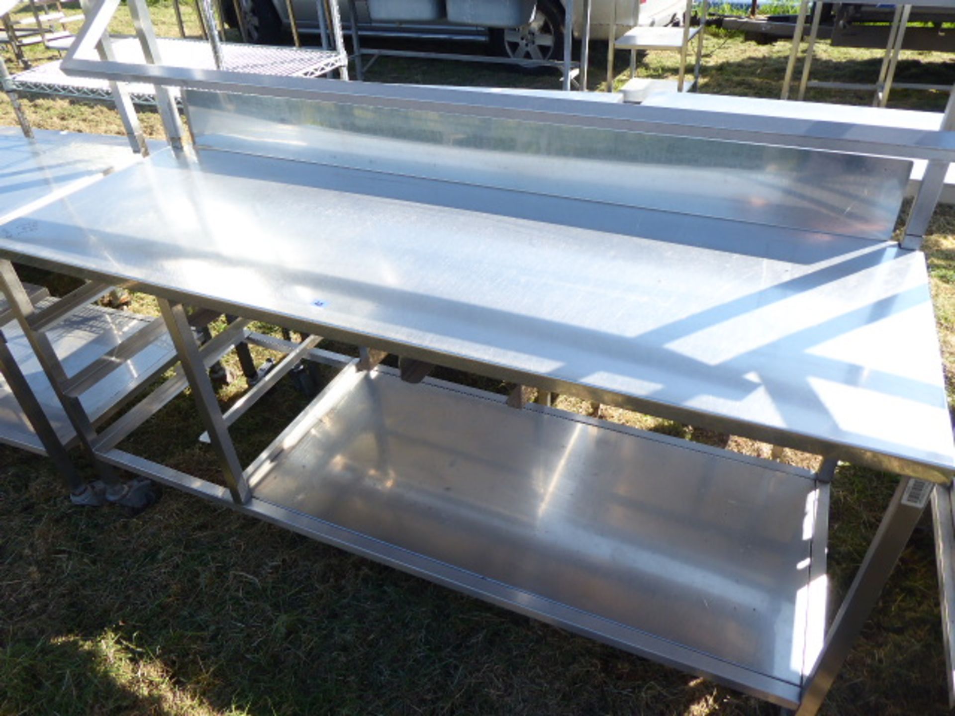 Stainless steel mobile food preparation station with 1 shelf over, shelf under space for trays and a - Image 2 of 2