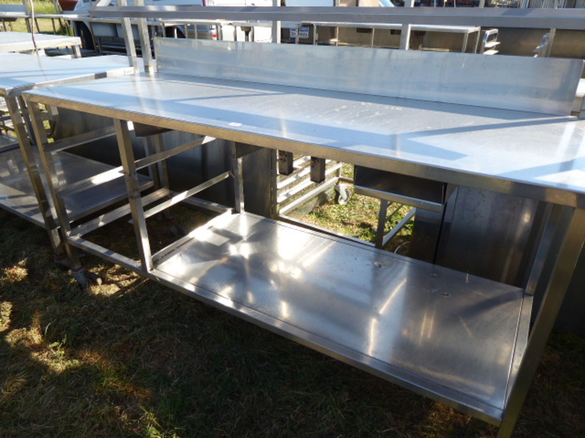 Stainless steel mobile food preparation station with 1 shelf over, shelf under space for trays and a - Image 2 of 2