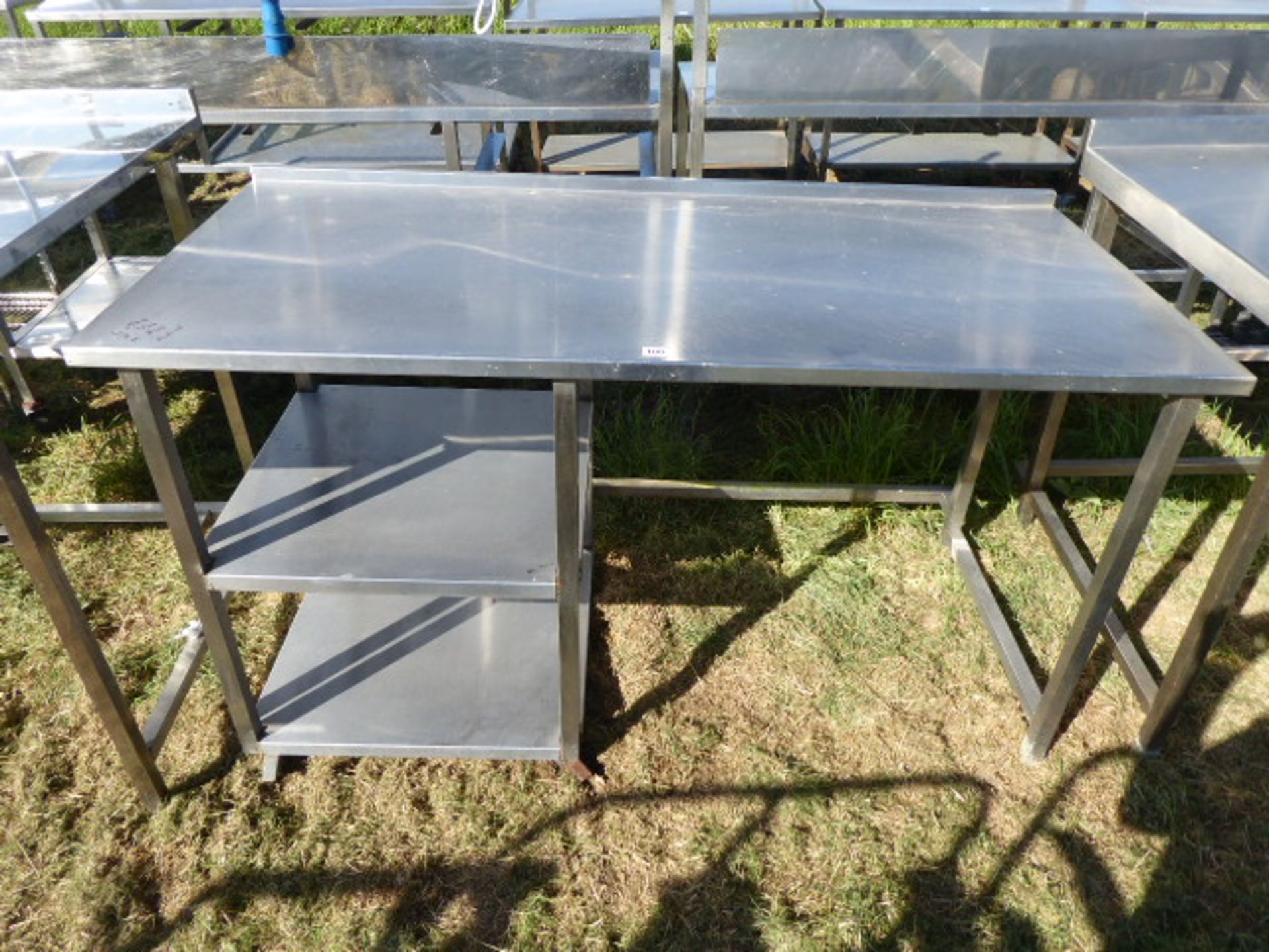 Mobile stainless steel preparation table with void under and 2 shelves underneath, 1500mm wide,