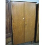 Mid century teak wardrobe raised on tapered legs