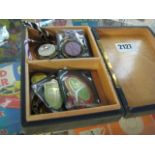 Small wooden box containing various medals