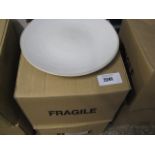 2 boxes containing round white dinner plates