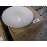 2 boxes containing round white dinner plates