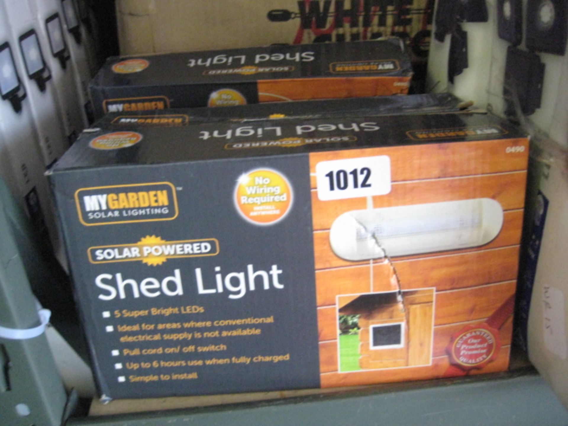 4 boxed LED wall lights with 3 packs of solar powered shed lights
