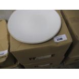 2 boxes containing round white dinner plates