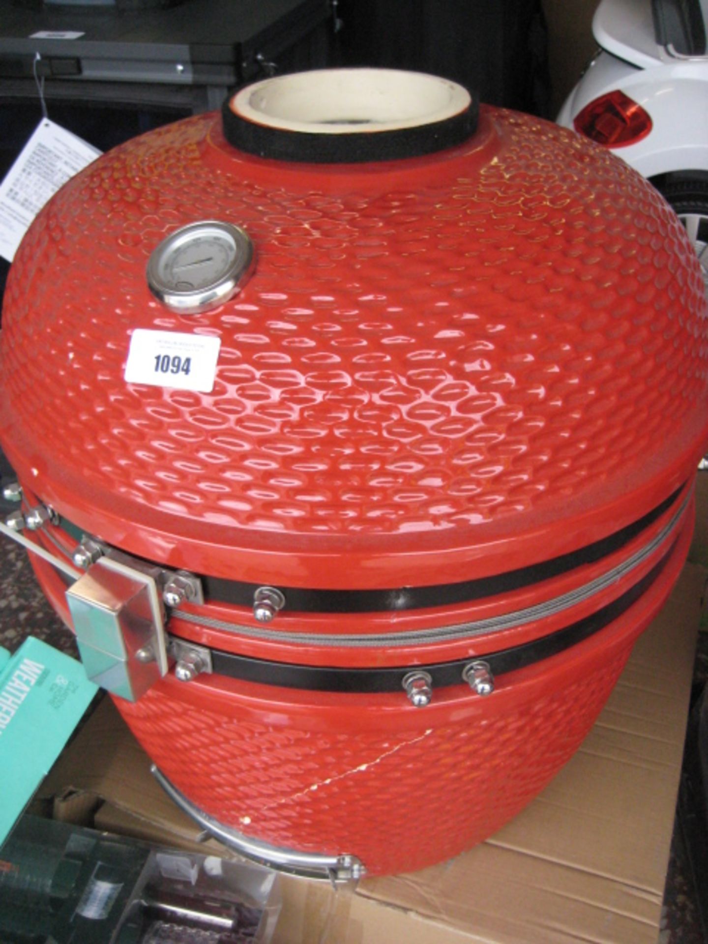 Flat pack Louisiana ceramic charcoal grill in red with accessories in box