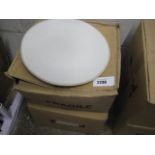 2 boxes containing round white dinner plates