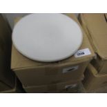 2 boxes containing round white dinner plates