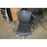 Black leatherette upholstered swivel barbers armchair on 5 star chrome base