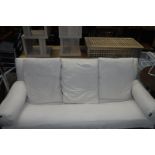 Beech framed futon with beige cushions