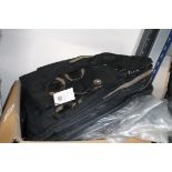 Box containing black rucksacks