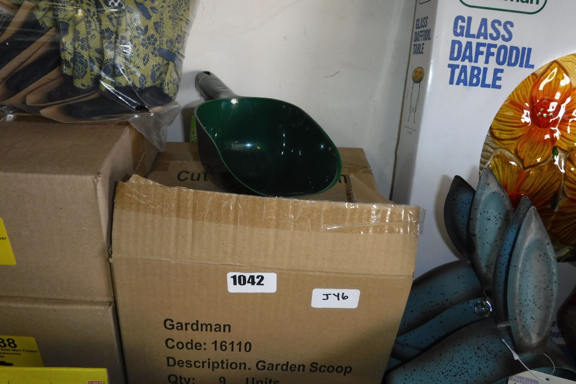 2 boxes of plastic garden scoops