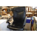 (2146) Black upholstered swivel office armchair