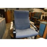 Blue upholstered easy chair with black bent wood frame