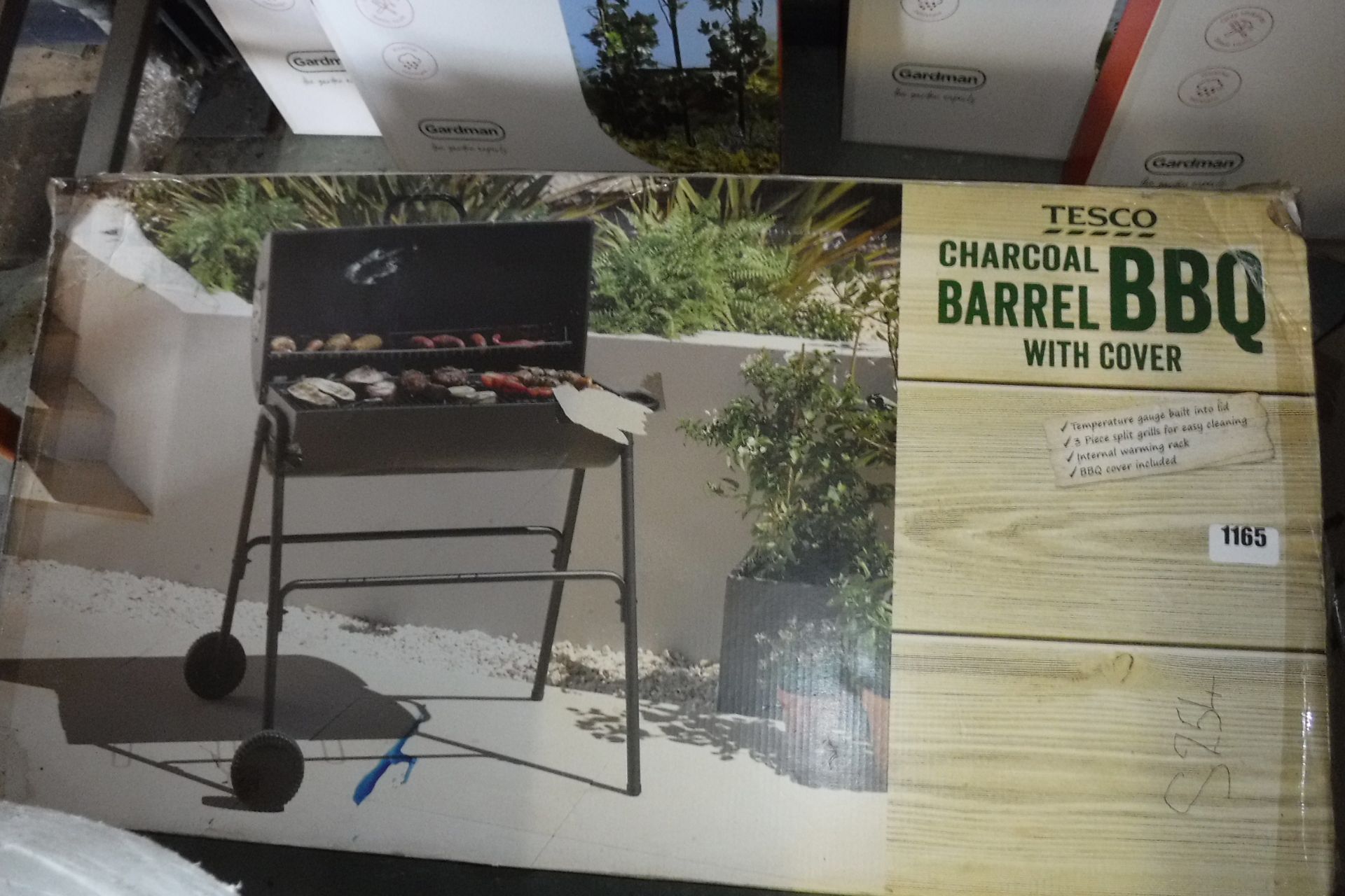 Boxed Tesco charcoal barrel BBQ