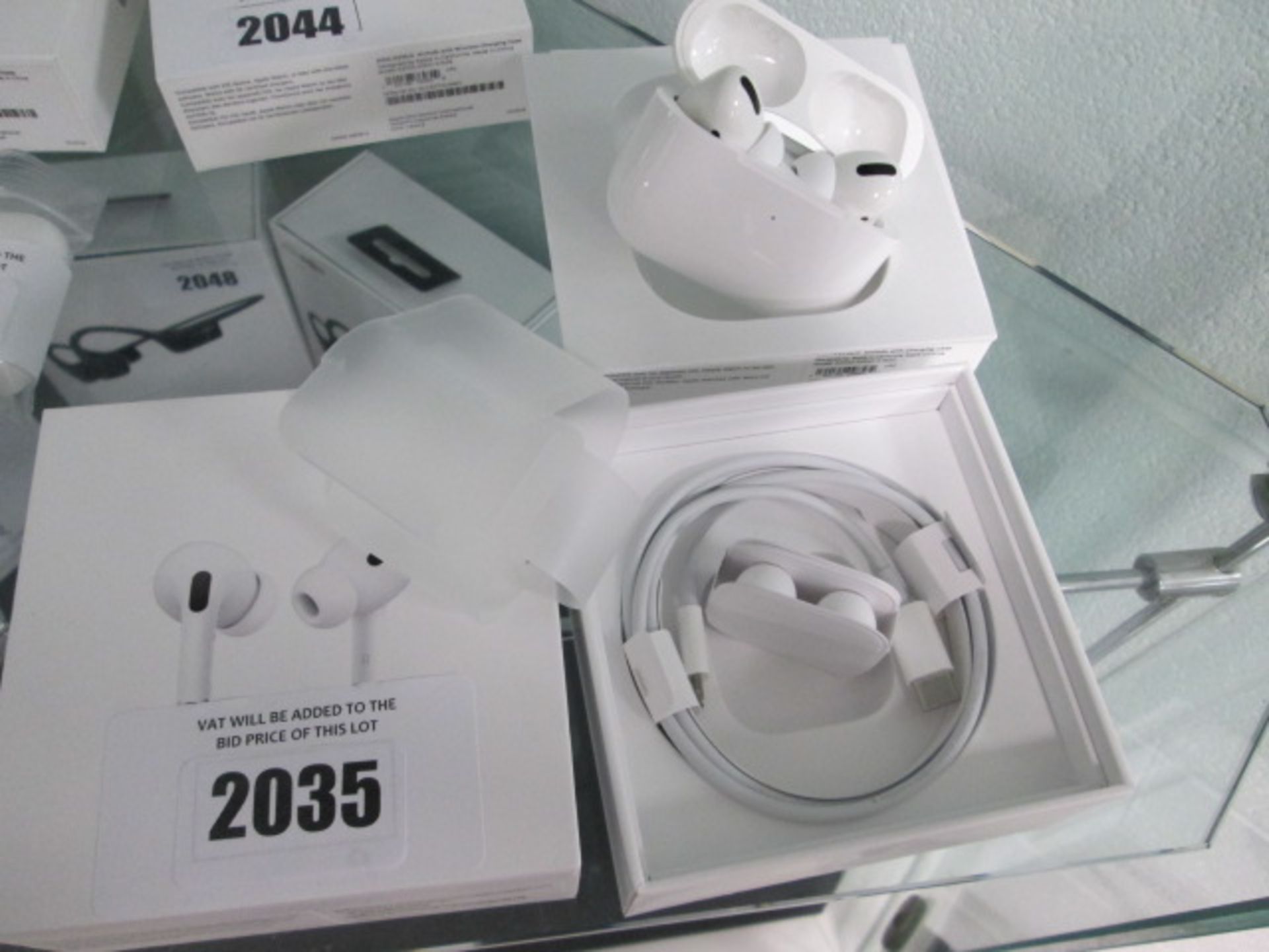 Apple Airpods Pro with wireless charging case and accessories in box