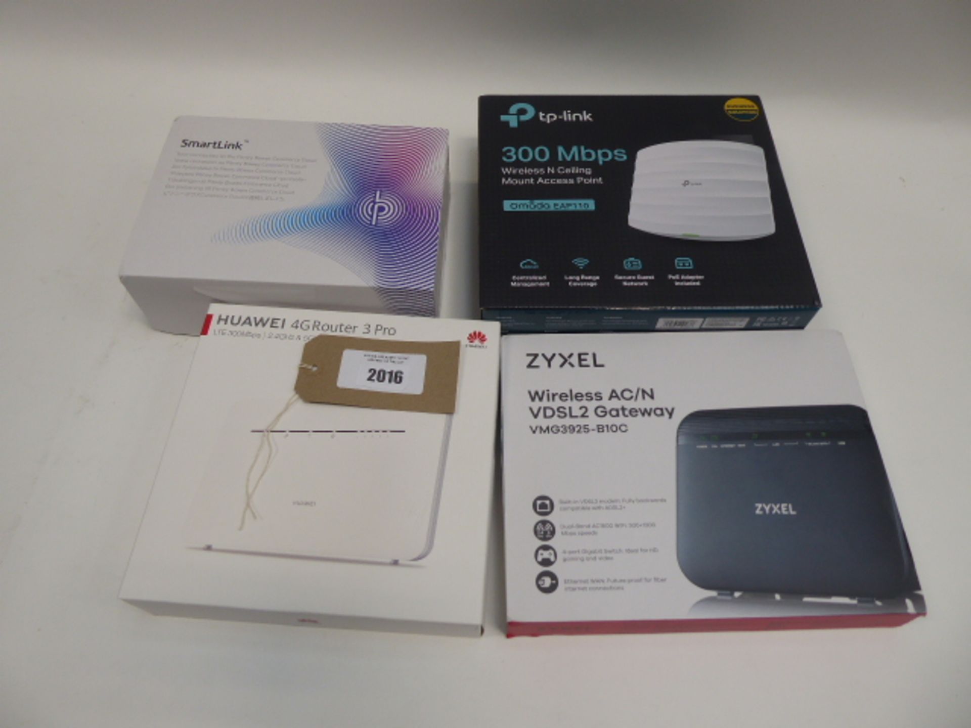 Bag containing 4 routers; Zyxel VDSL2, TP-Link, Huawei 4G Router Pro and Smartlink