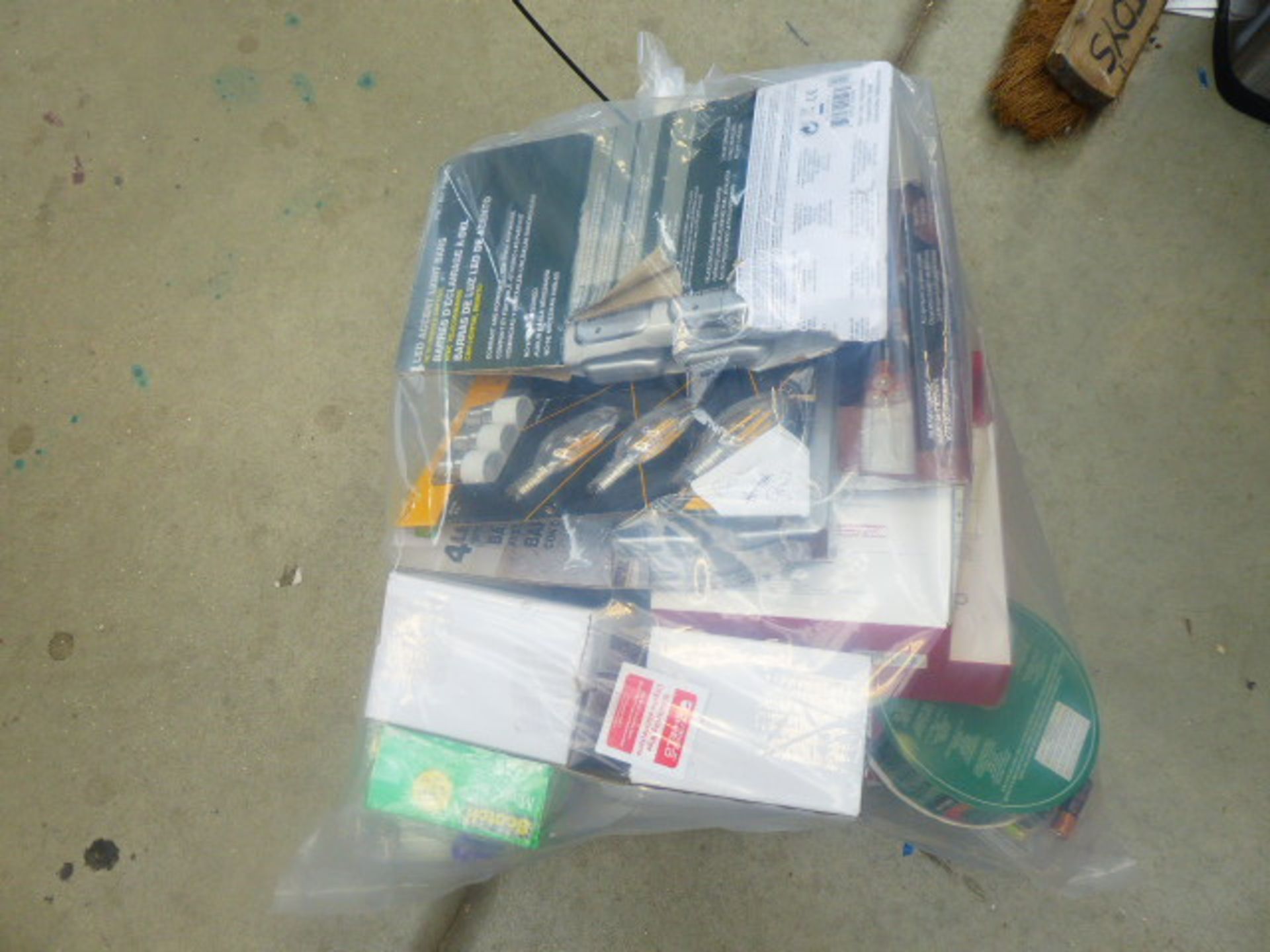 Bag containing LED light bulbs, disinfecting wipes, tapes etc