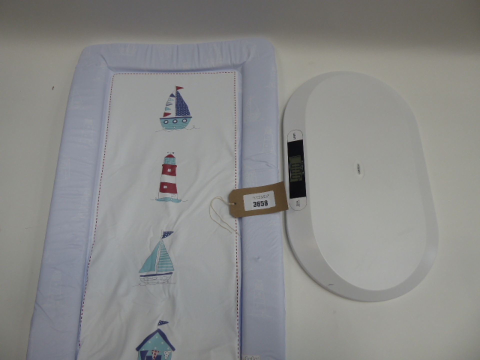Baby changing mat and baby weighing scales