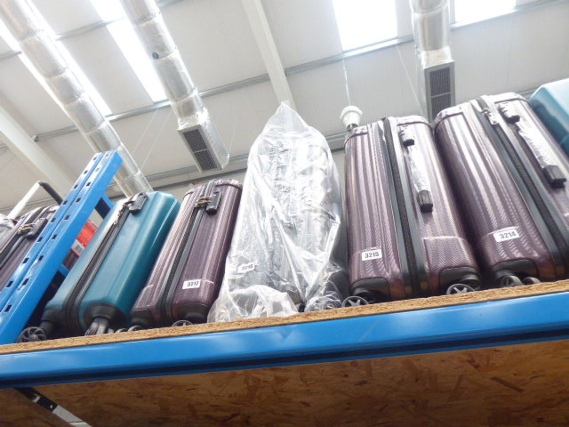 Medium size grey hard shell suitcase