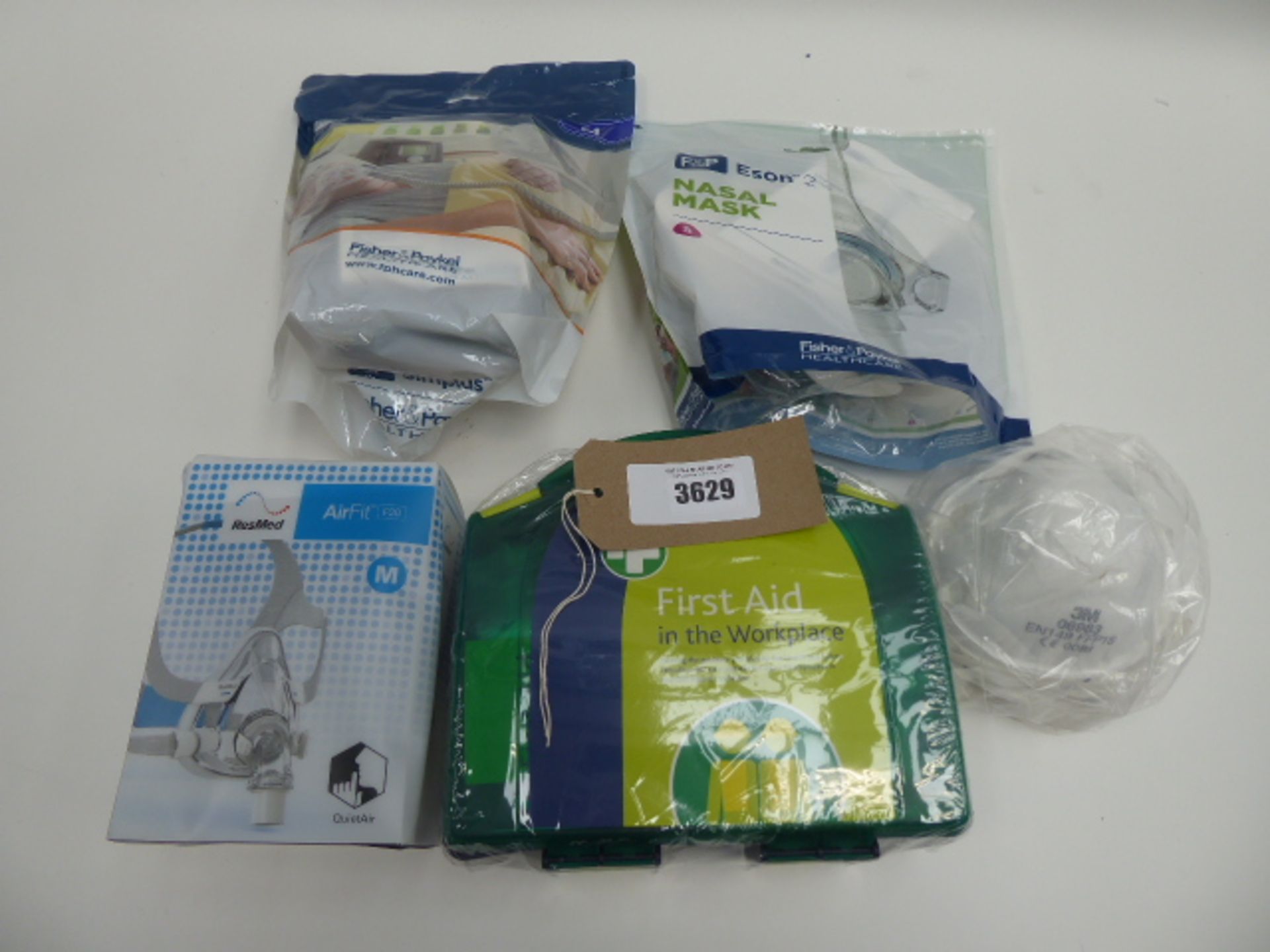 Bag containing CPAP masks (ResMed AirFit, F&P nasal mask, F&P Simplus ), 3M masks and first aid kit