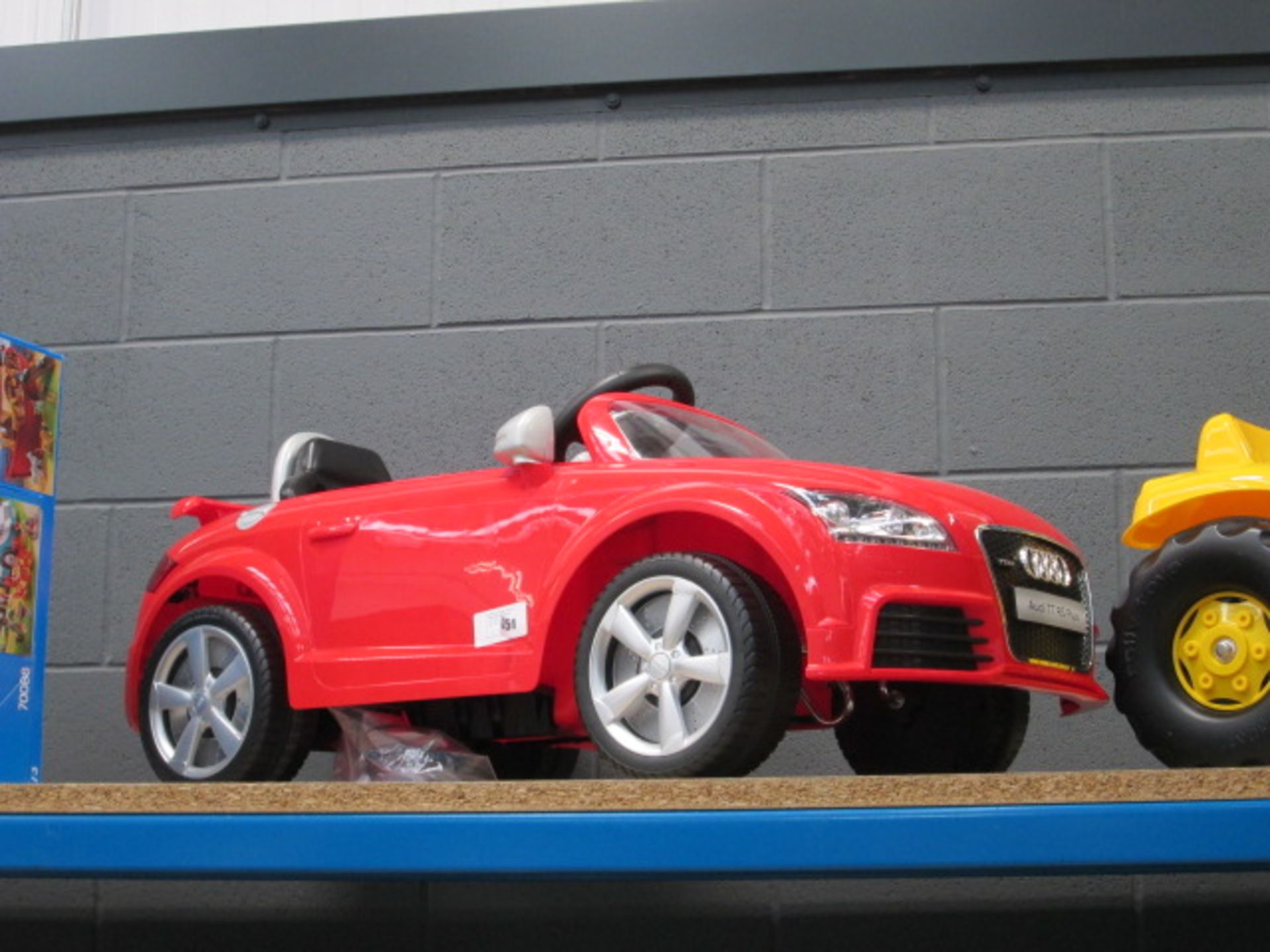 Electric red Audi TT car with charger
