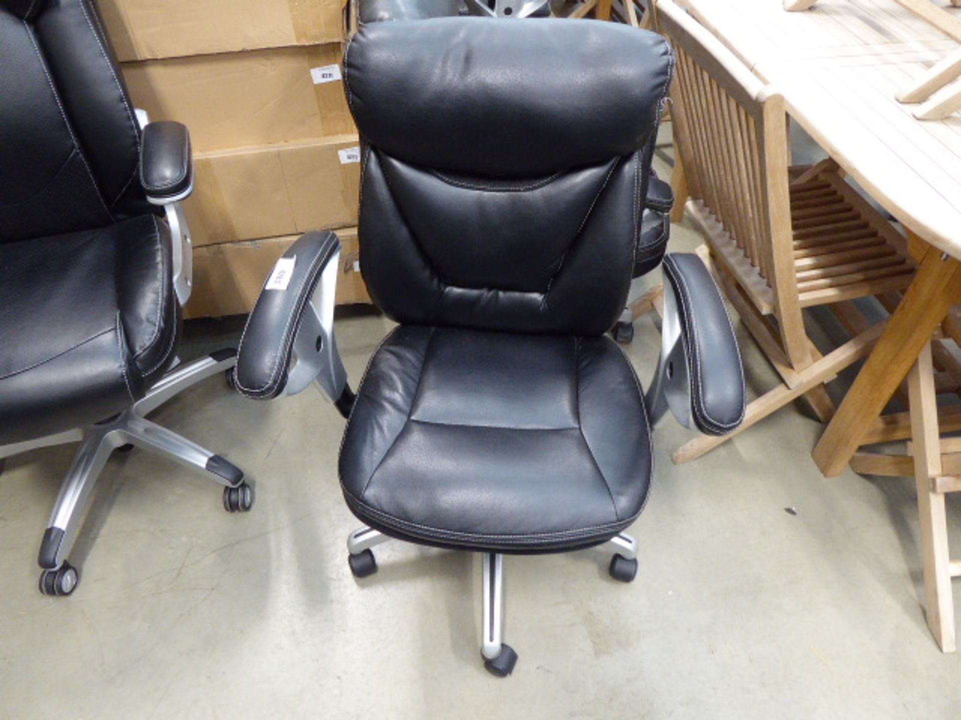 2 black swivel chairs