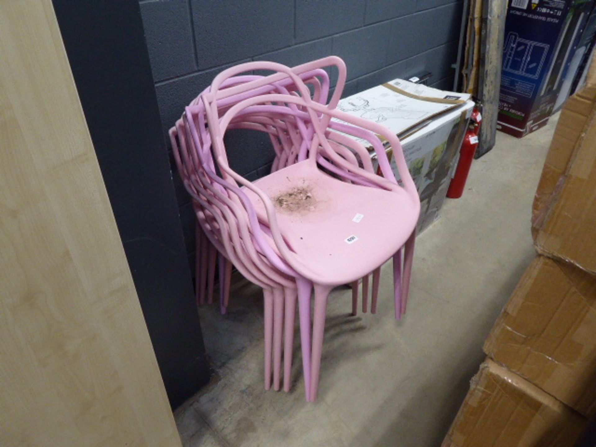 5 assorted pink plastic chairs