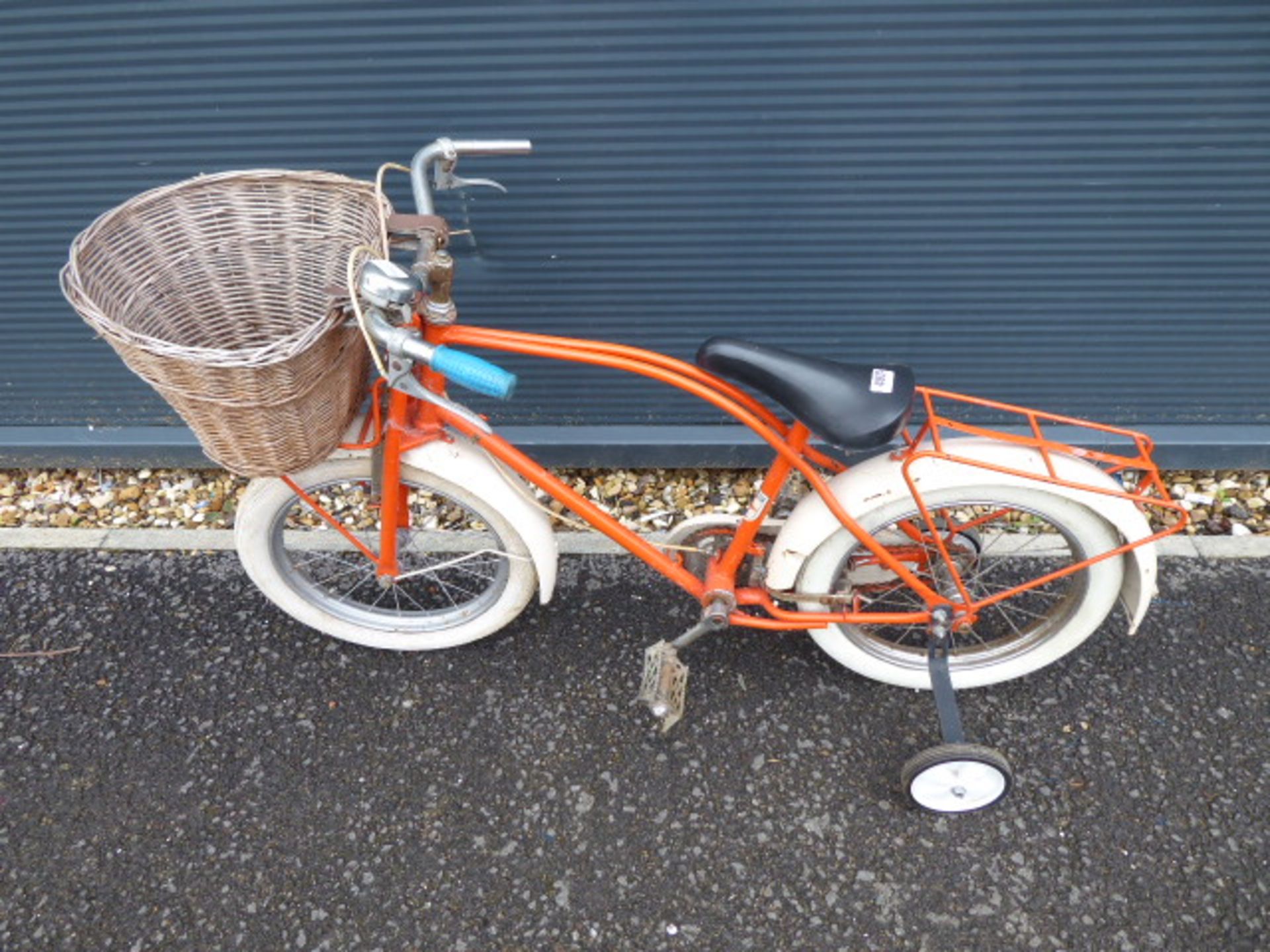 Orange and cream child's cycle with front basket